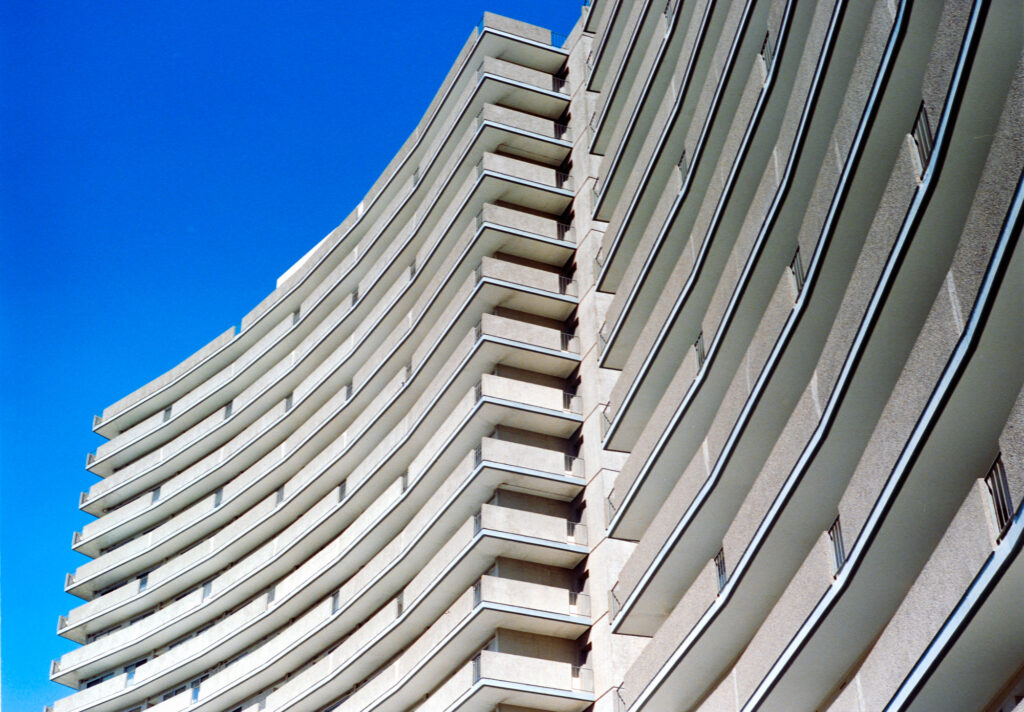 A condominium stretches into the sky. 